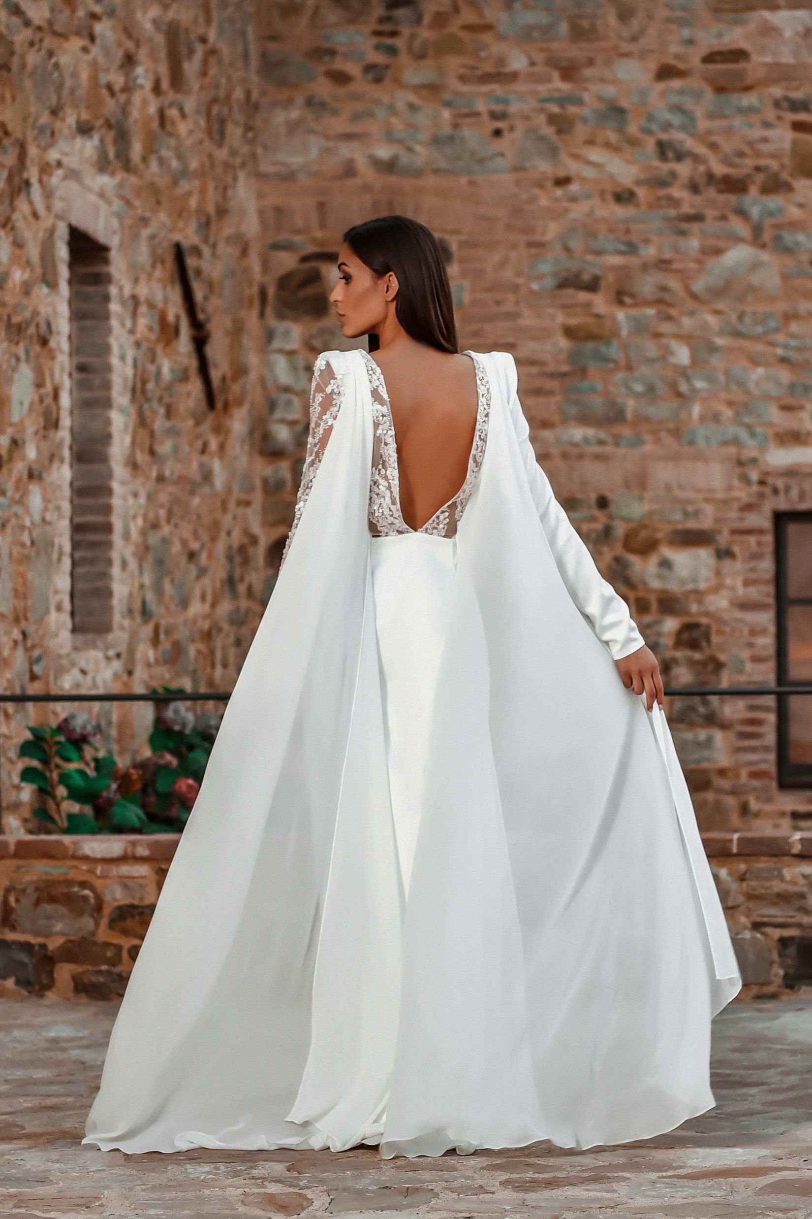 ORSOYA Bridal Dress: Crystal embellishment, cape-sleeve and flyaway gown.