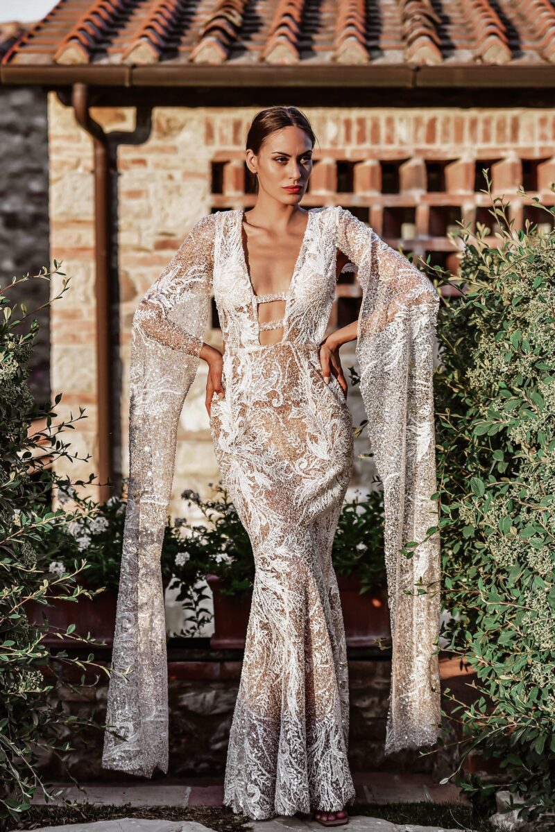 ORSOYA Bridal Dress: Sequin, beaded, ivory lace with mermaid style and flowing sleeves.
