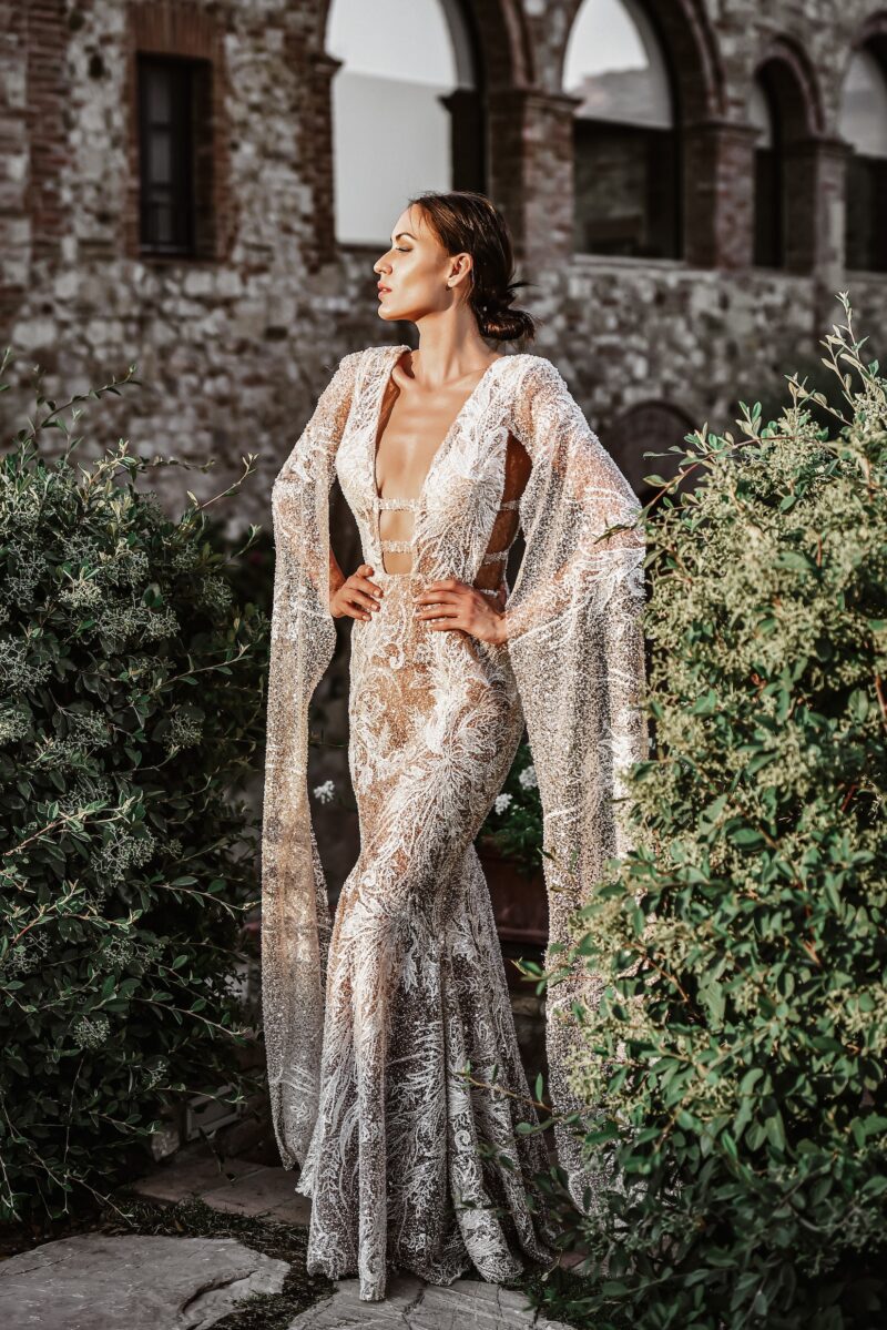 ORSOYA Bridal Dress: Sequin, beaded, ivory lace with mermaid style and flowing sleeves.